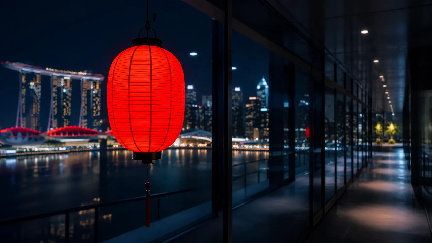 Red lantern in modern glass corridor with Marina Bay bokeh — Contact TheNewGate Asia Pacific